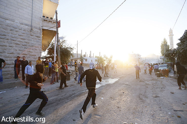 עימותים בין צעירים פלסטינים לחיילים בעקבות הריגתו של מוחמד חמאמרה, 22 ביולי 2014. (מוסטפא באדר/ אקטיבסטילס)
